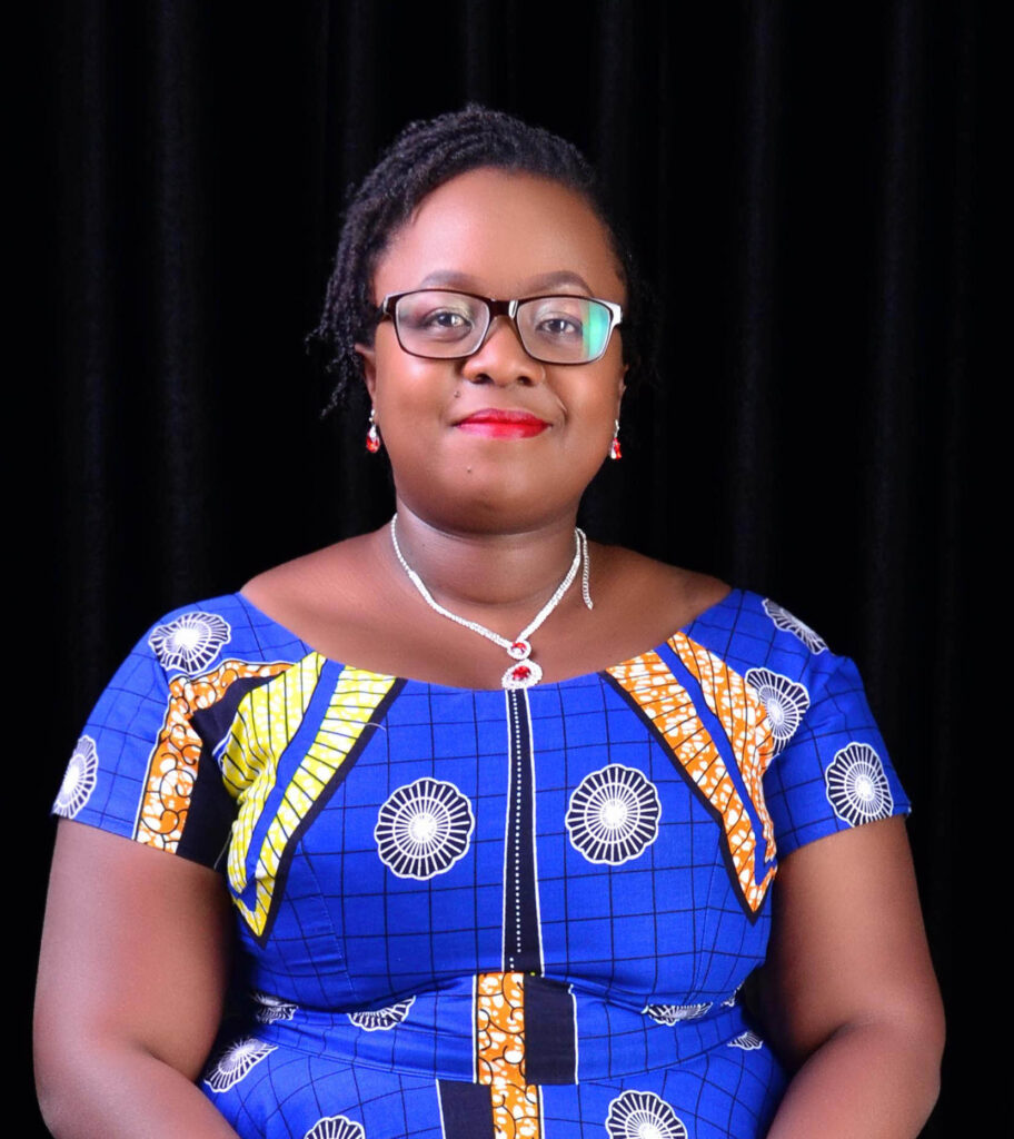 Annabell seated against black background